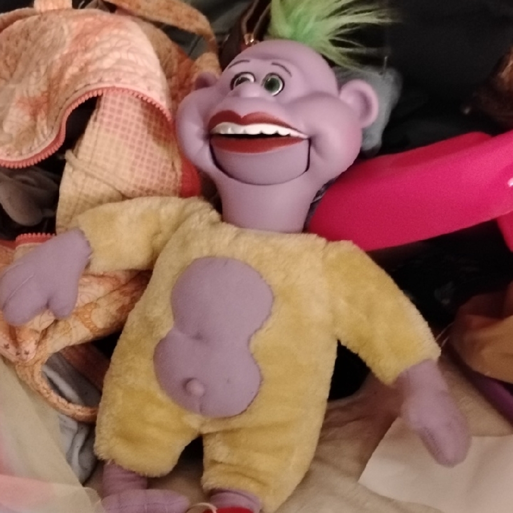 Purple and Yellow Plush Character Toy